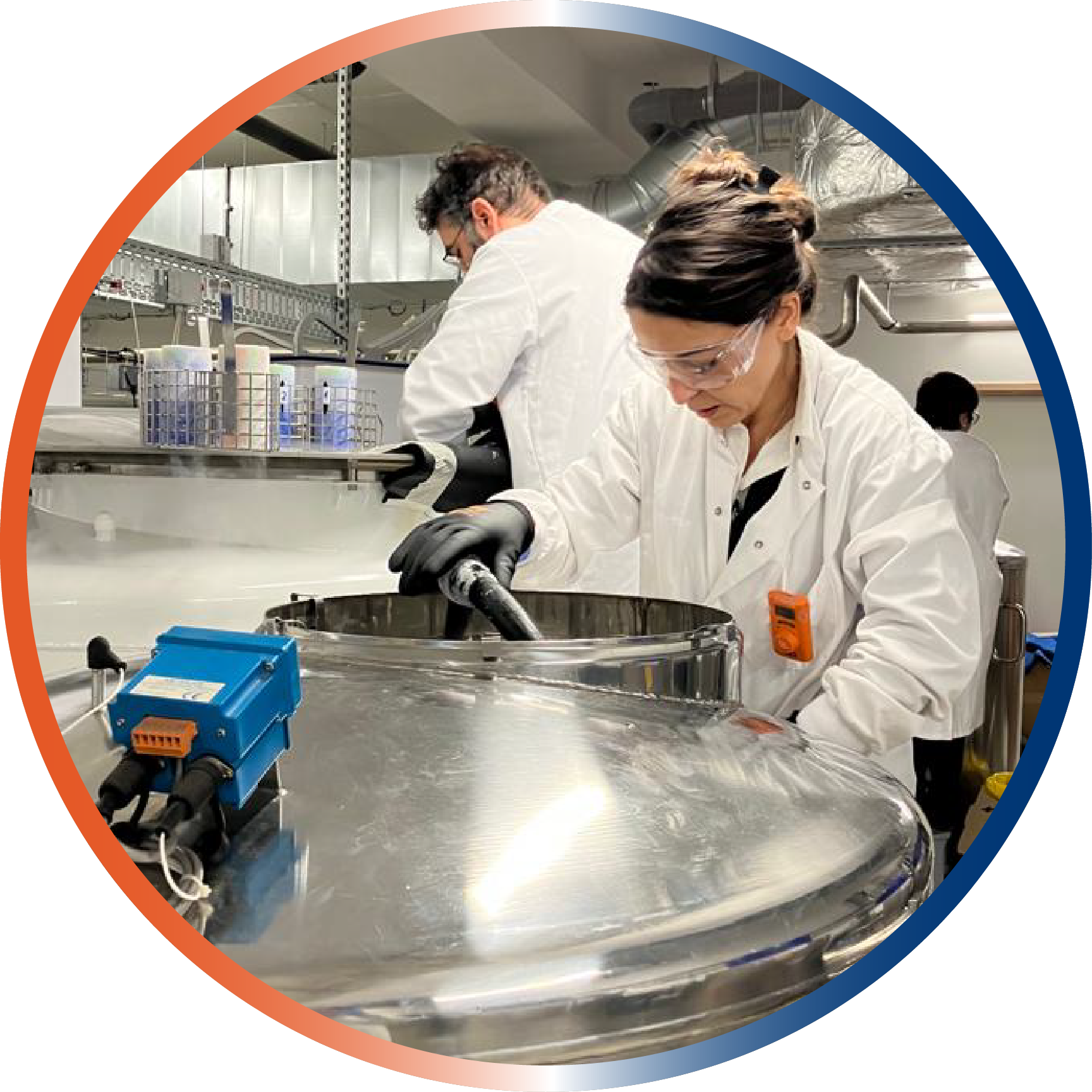 Biobank staff with lab coat and gloves at work in the IARC/WHO biobank. (c) IARC/WHO