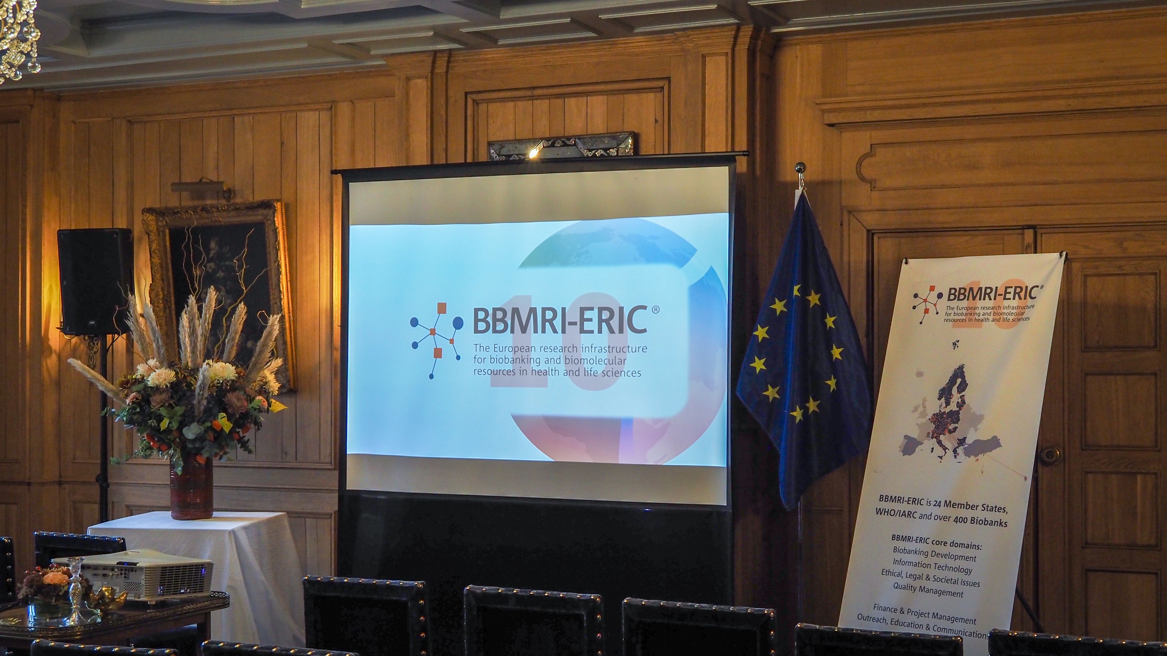 A picture with a poster and the BBMRI-ERIC logo. 