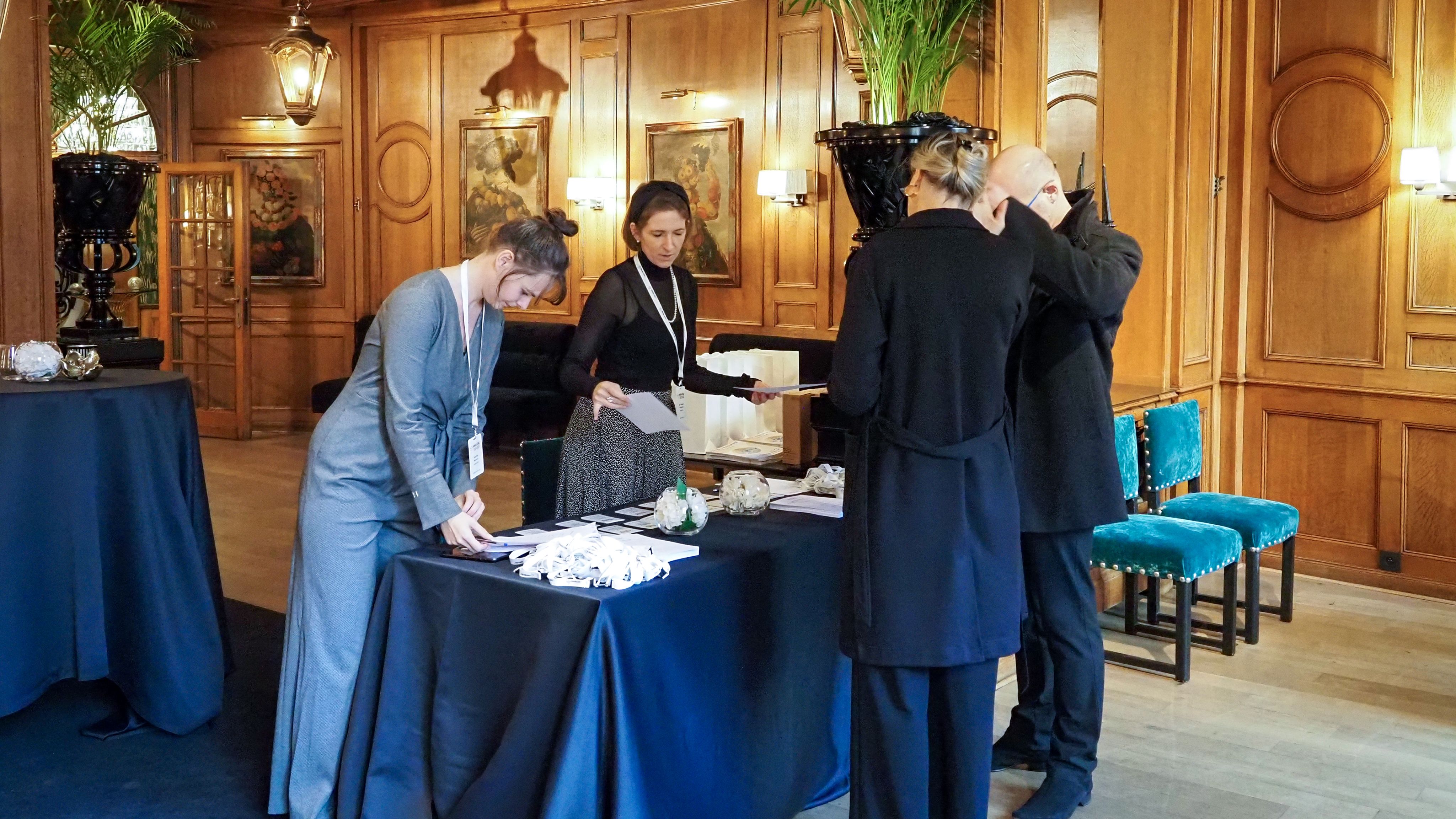 The picture of BBMRI-ERIC'S staff welcoming guests at the event venue. 